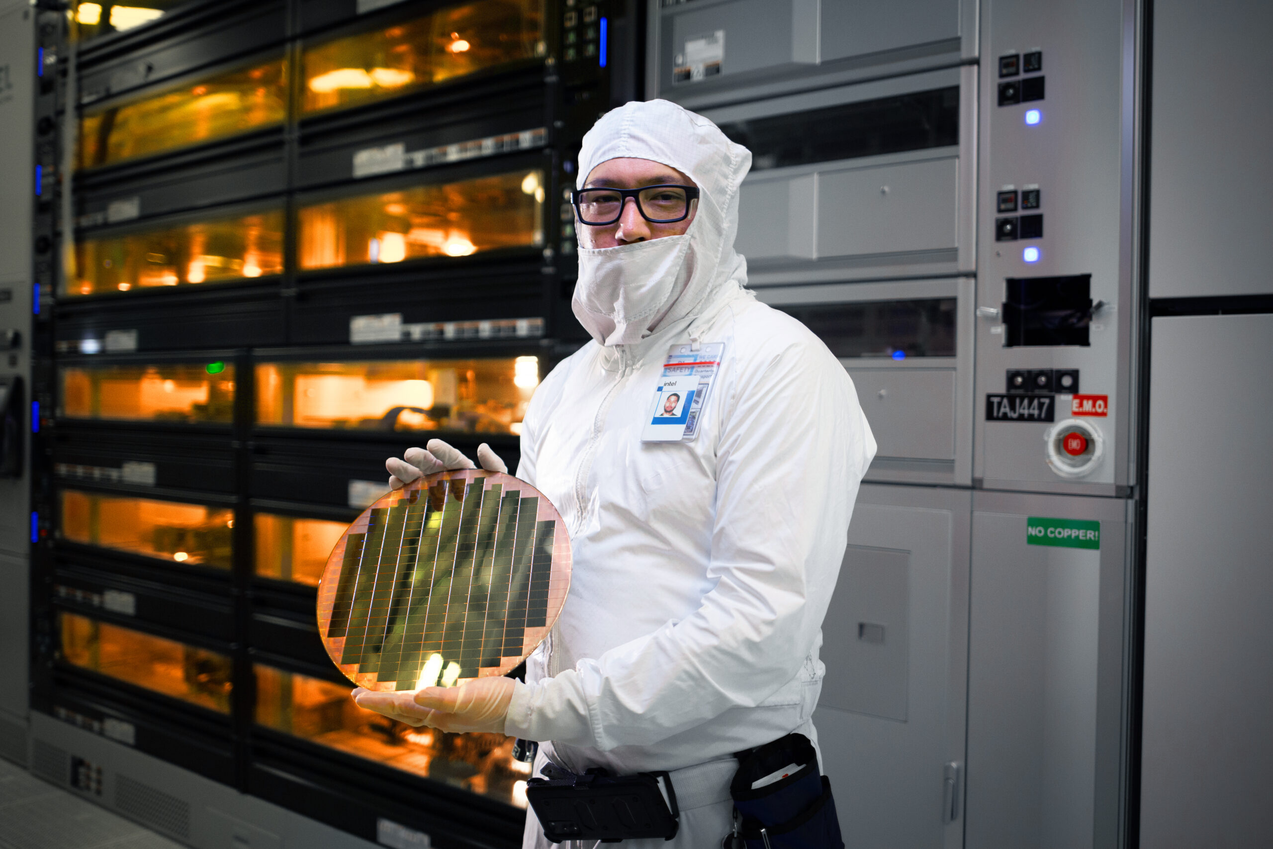 Intel employee holding semiconductor wafer with 3D stacked Foveros technology. Image: Intel