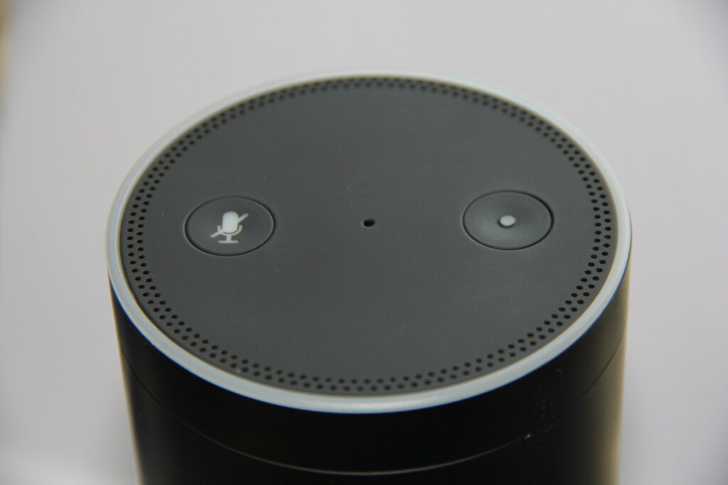 Amazon Echo Plus smart speaker on table running Alexa voice assistant