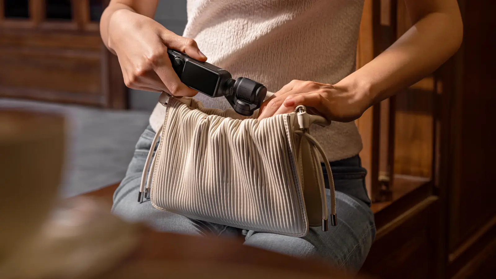 DJI Osmo Pocket 3, the camera the DJI Osmo Pocket 4P succeeds, slipped into a bag