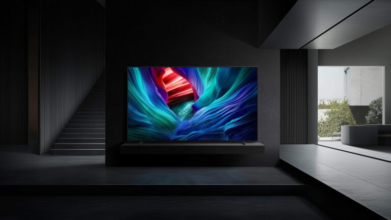 Samsung Micro RGB TV mounted on a dark media wall