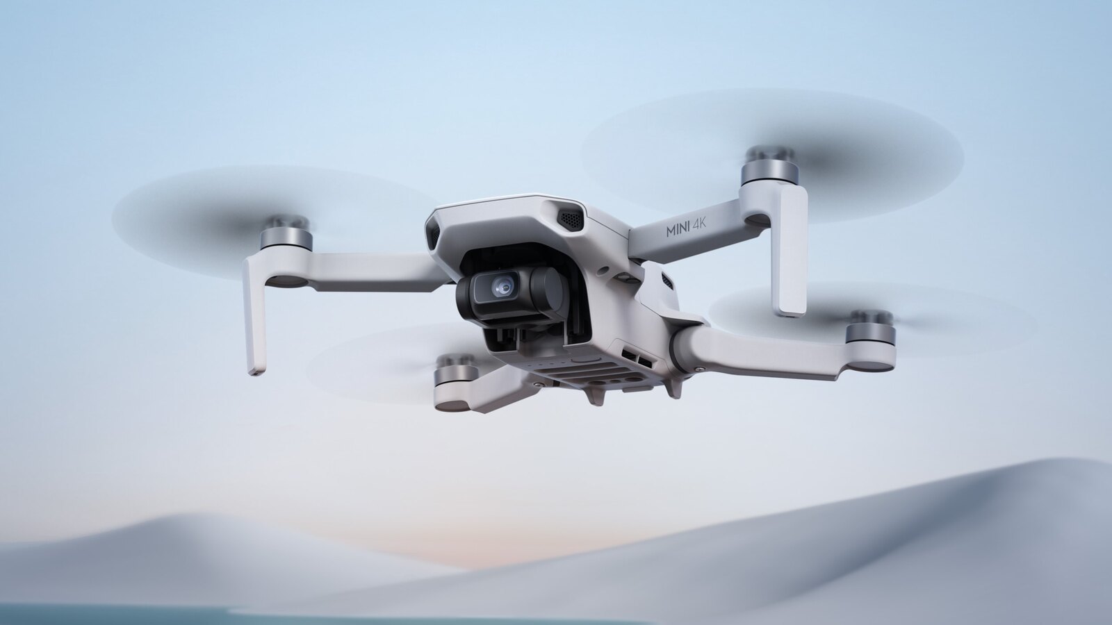 Best beginner drone UK budget pick, the DJI Mini 4K, flying over water