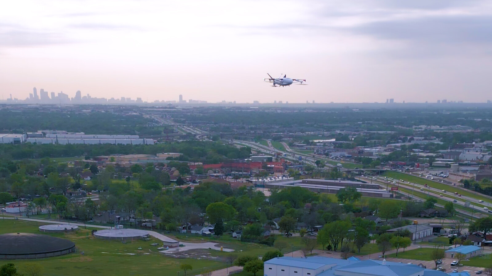 Zipline drone delivery scaling over a North Texas city