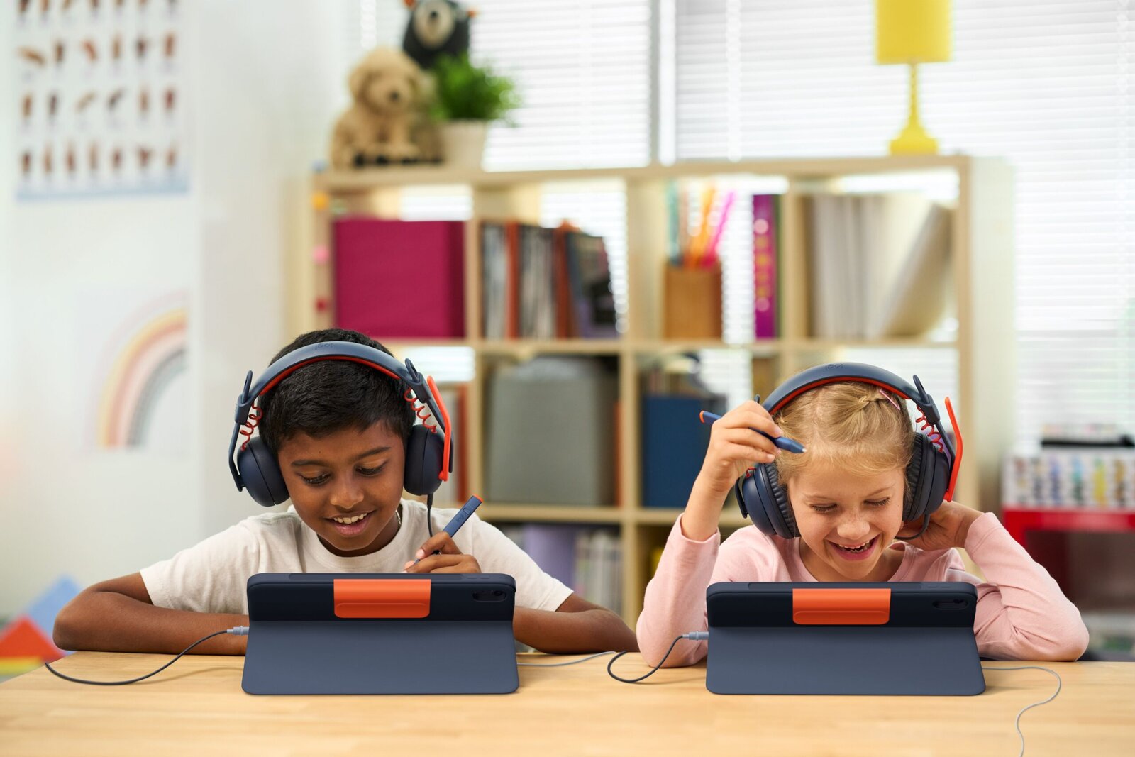 Logitech Rugged Combo 4c Touch iPad case with student wearing wired headphones
