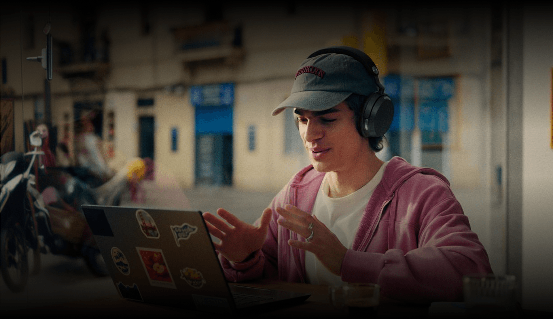 Sennheiser Momentum 5 Wireless aptX Lossless worn working on a laptop