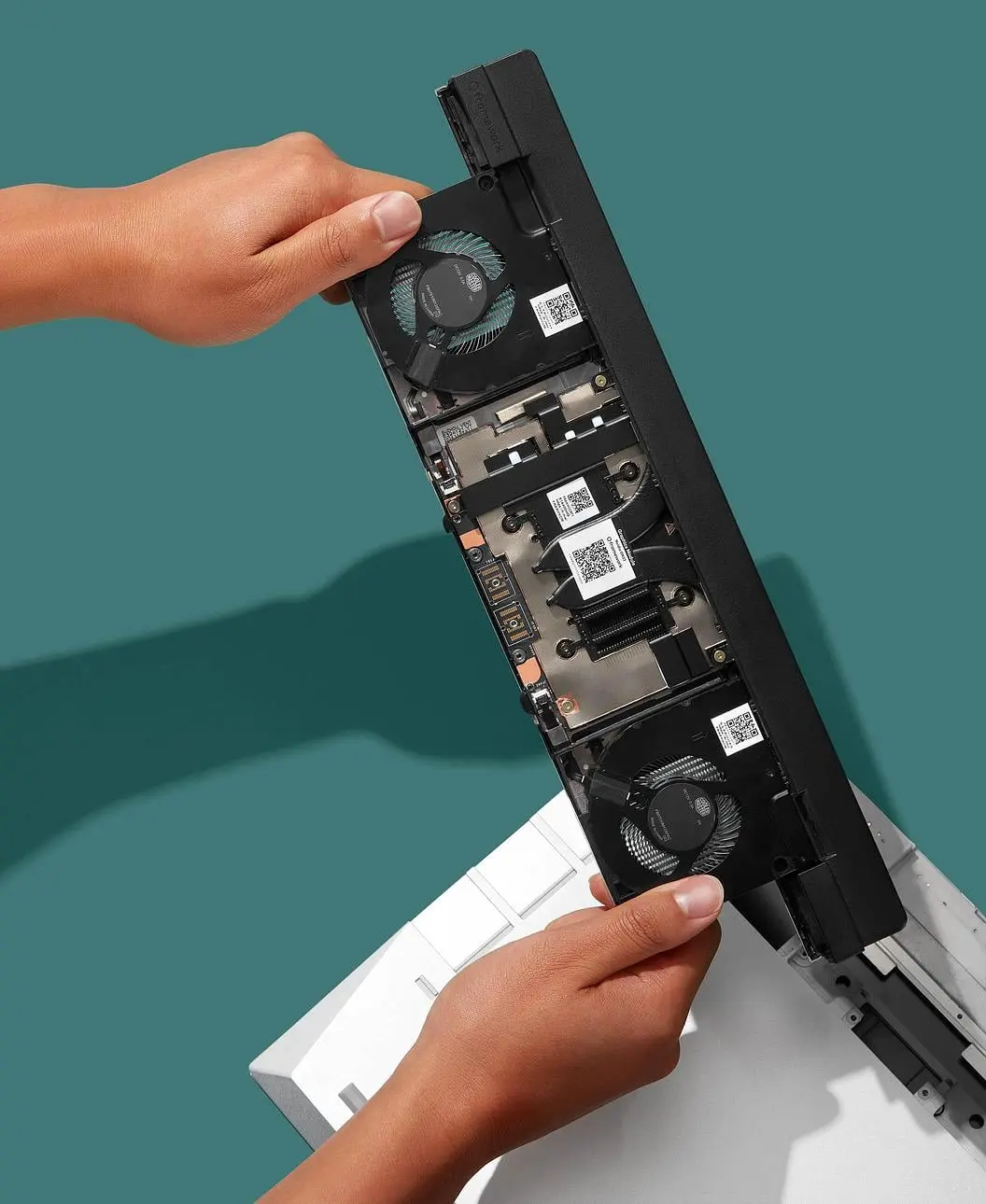 Framework RTX 5070 graphics module being installed into Framework Laptop 16