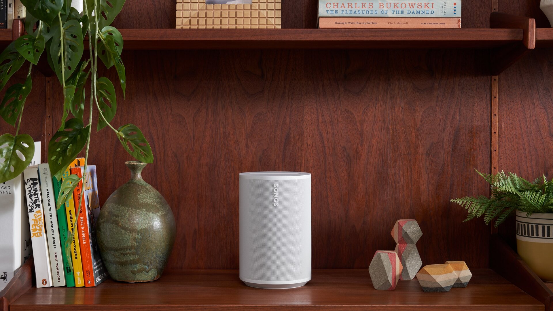 Sonos Era 100 best smart speaker UK 2026 mid-priced pick on a bookshelf