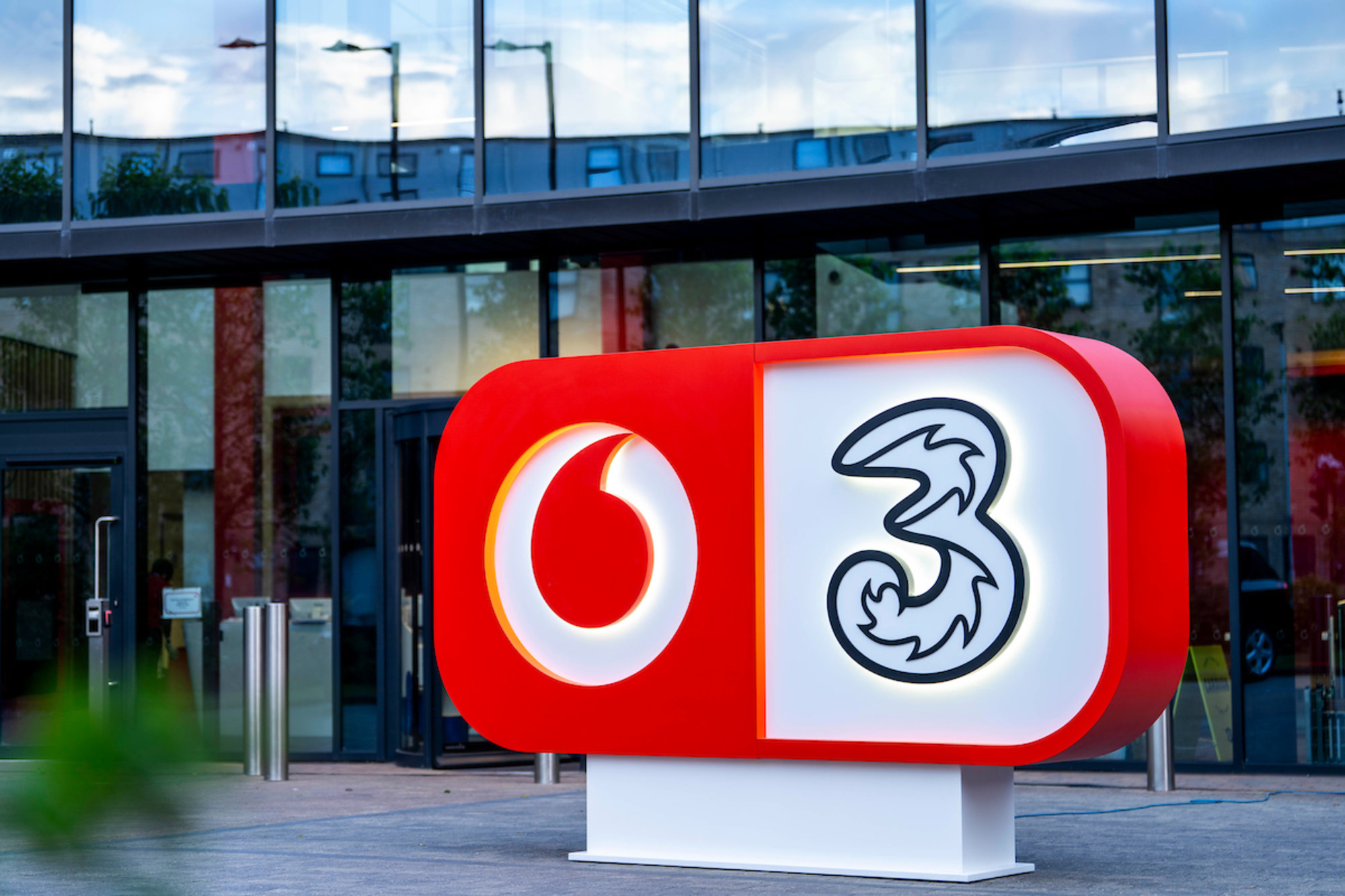 VodafoneThree full ownership branded logo at The Speechmark office headquarters