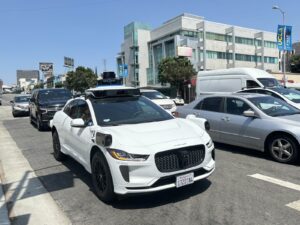 Waymo robotaxi recall Jaguar I-Pace on Westwood Boulevard Los Angeles