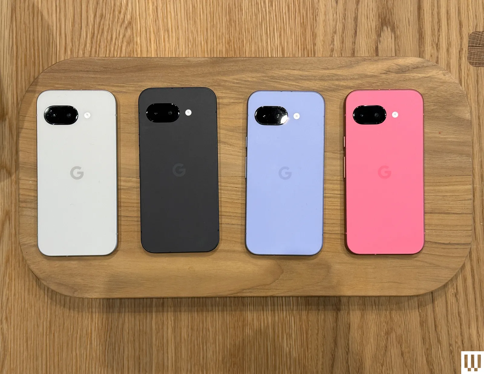 Google Pixel 9a held in one hand