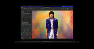 A 14-inch MacBook Pro with the M5 chip running Capture One, editing a colour portrait on its Liquid Retina XDR display