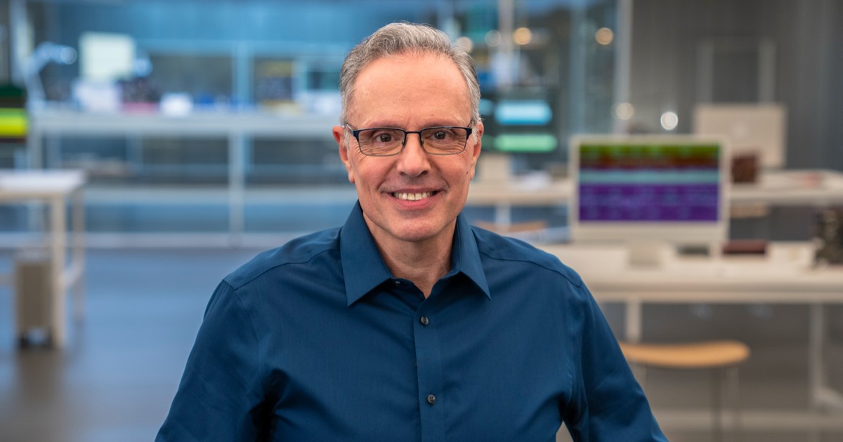 Johny Srouji, a senior Apple hardware leader, in a portrait against a dark background