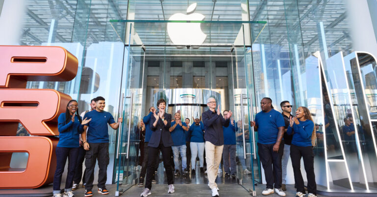 Latest iPhone, Apple Watch and AirPods arranged on a display table inside an Apple Store