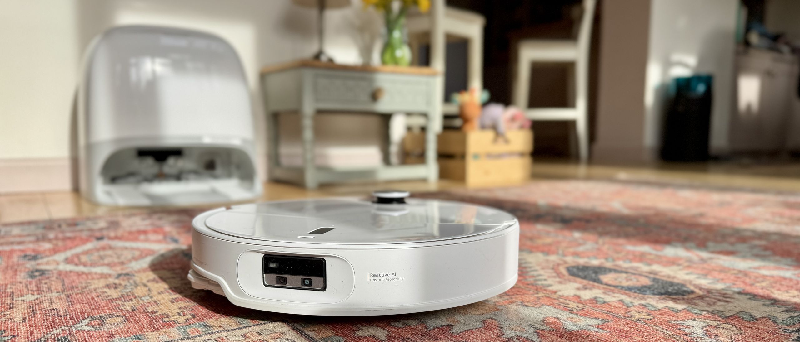 Roborock Qrevo Curv 2 Pro robot vacuum docked at its self-emptying base station