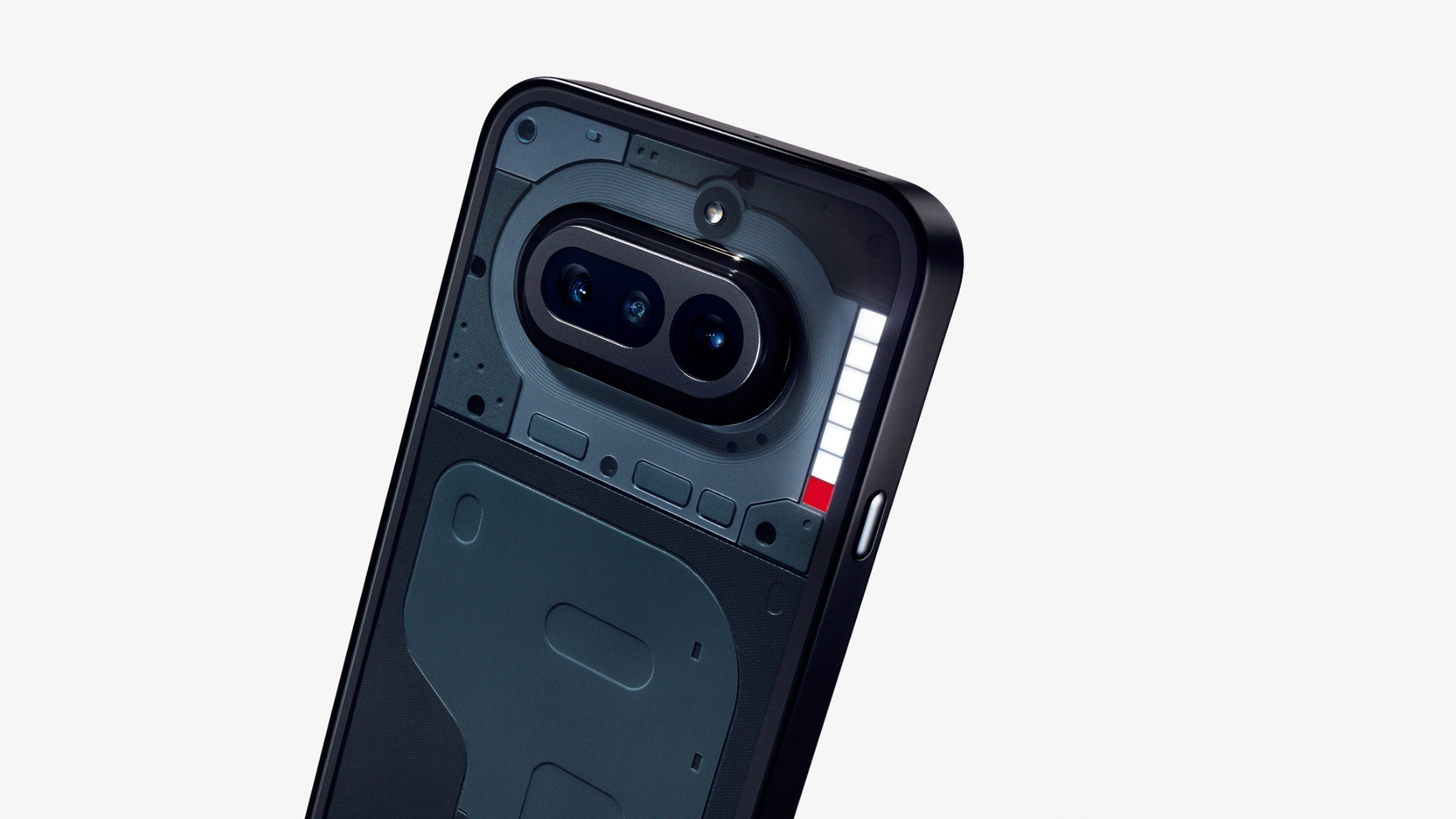 Close-up of the black Nothing Phone 4a showing its dual camera module and transparent Glyph back