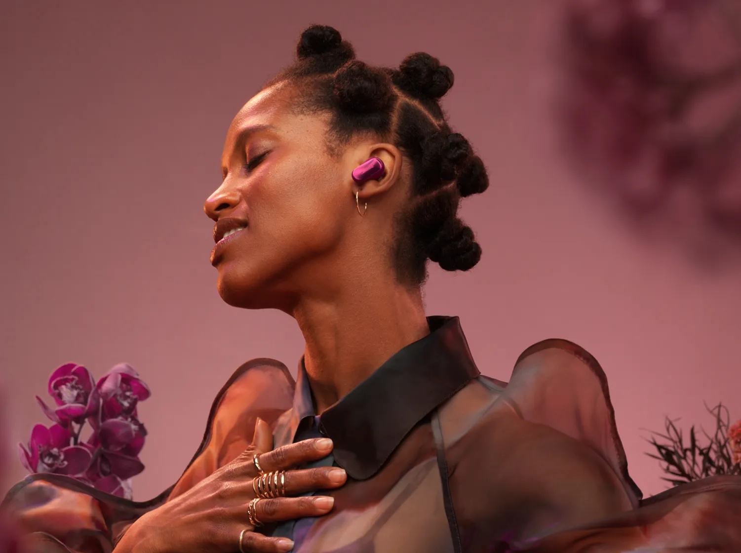 Woman wearing a Bose QuietComfort Ultra Earbud 2nd Gen in Deep Plum