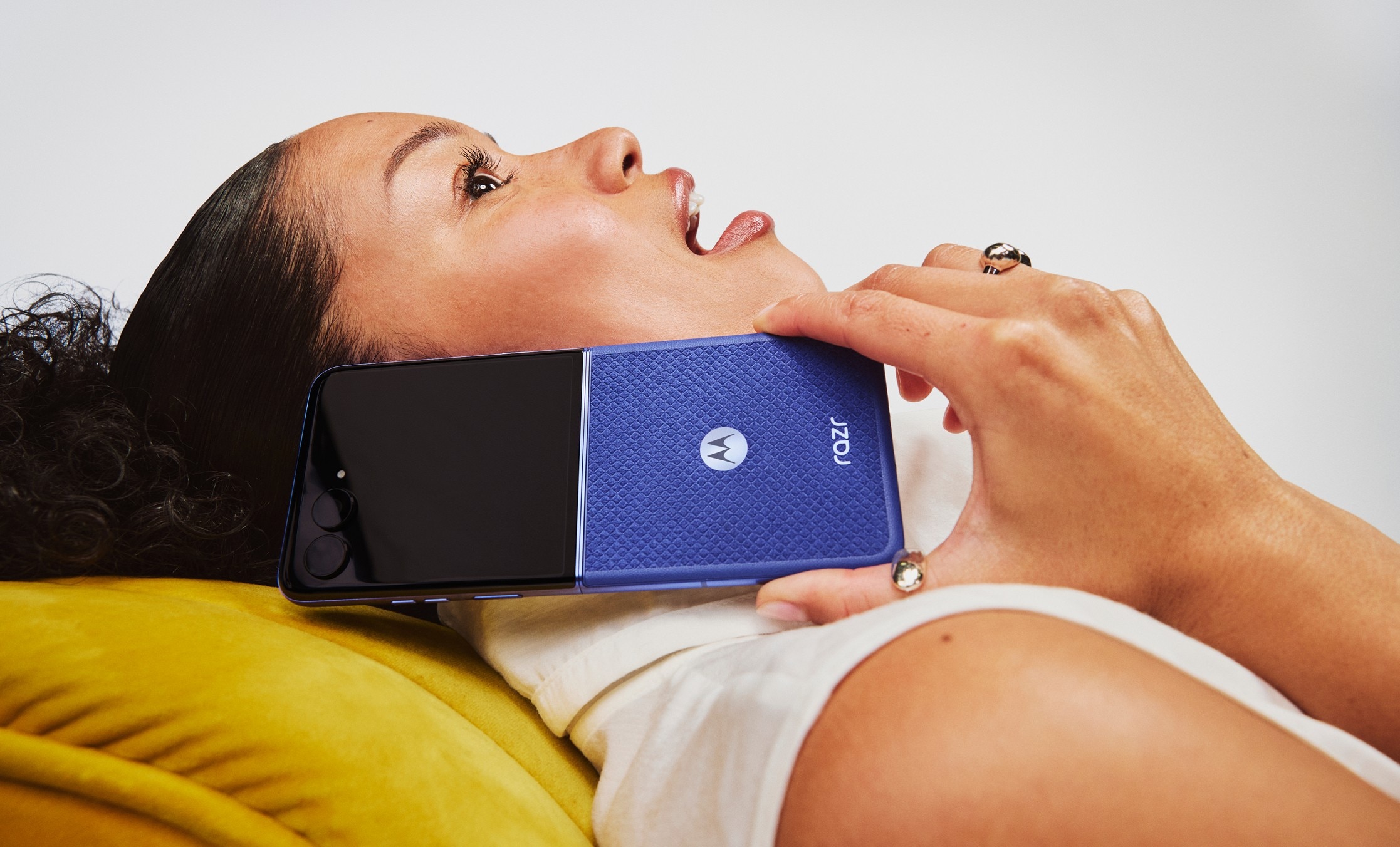 Motorola Razr 70 Ultra in Orient Blue held to the ear during a call