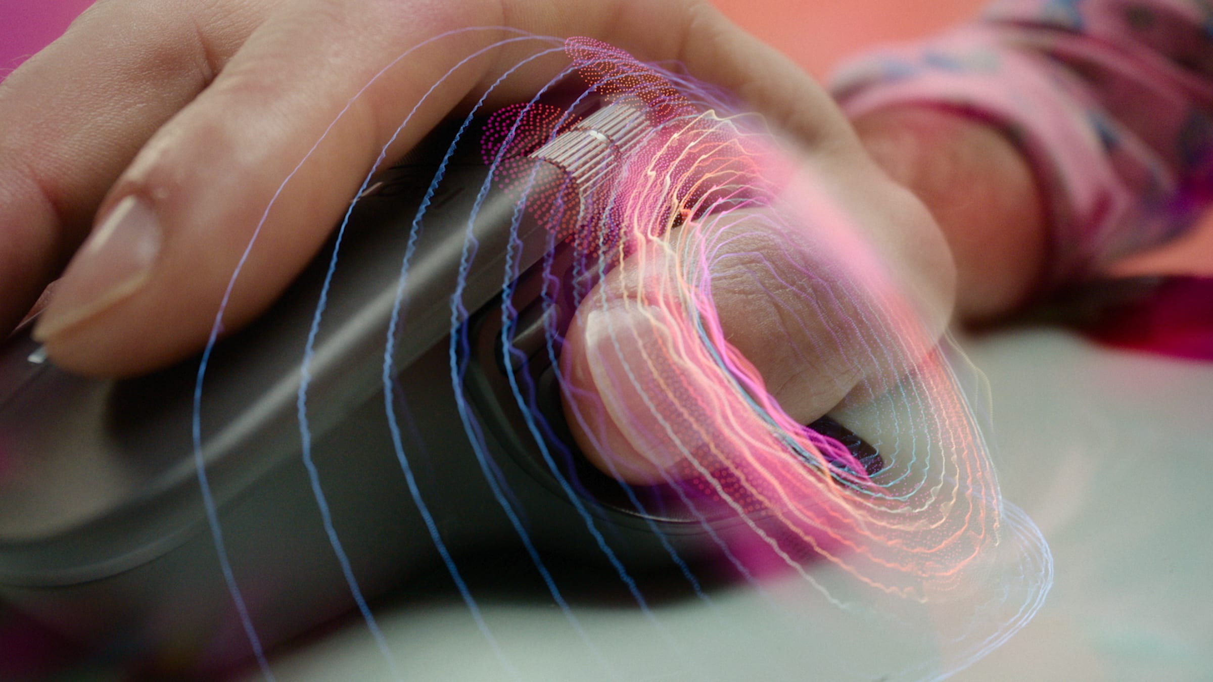 Hand resting on the Logitech MX Master 4 with coloured haptic ripples around the thumb rest