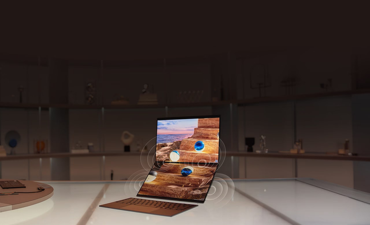 ASUS Zenbook DUO open showing both 14-inch OLED screens in use on a desk