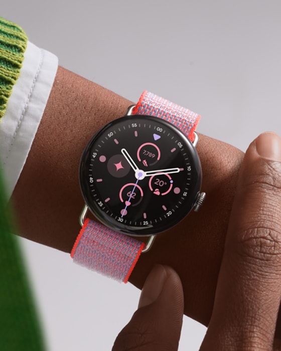 Pixel Watch 4 41mm model held in a hand showing the band
