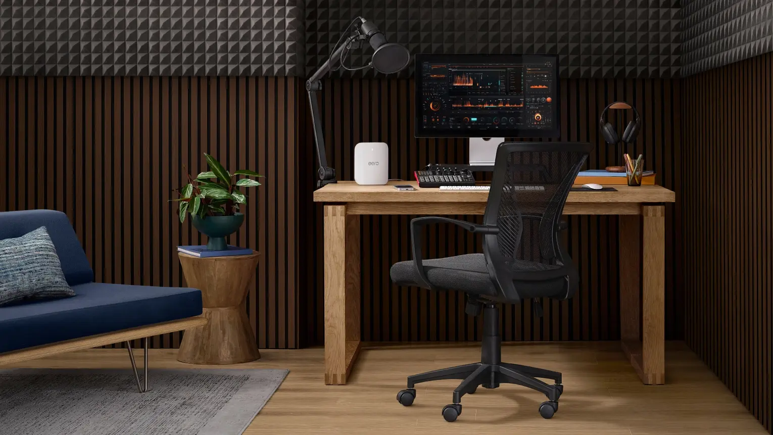 Amazon eero mesh Wi-Fi node on a desk in a home office setup