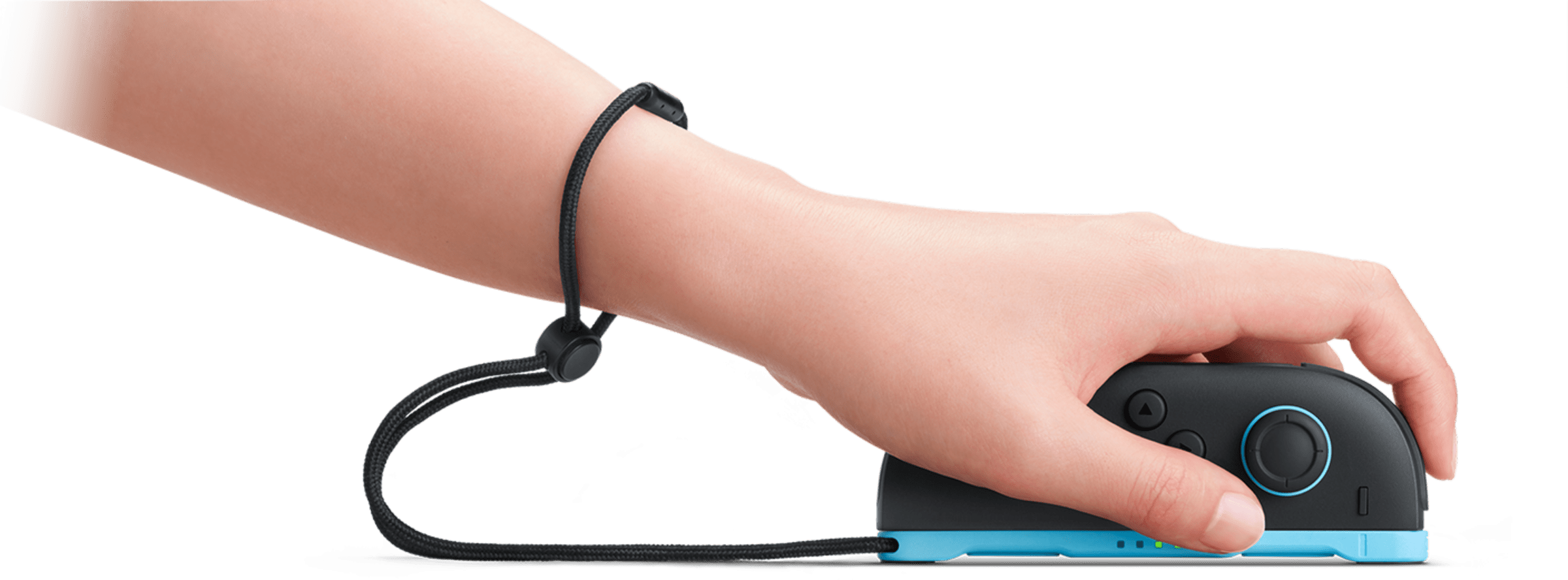 A hand sliding a Nintendo Switch 2 Joy-Con 2 on a desk to use its new mouse-mode control