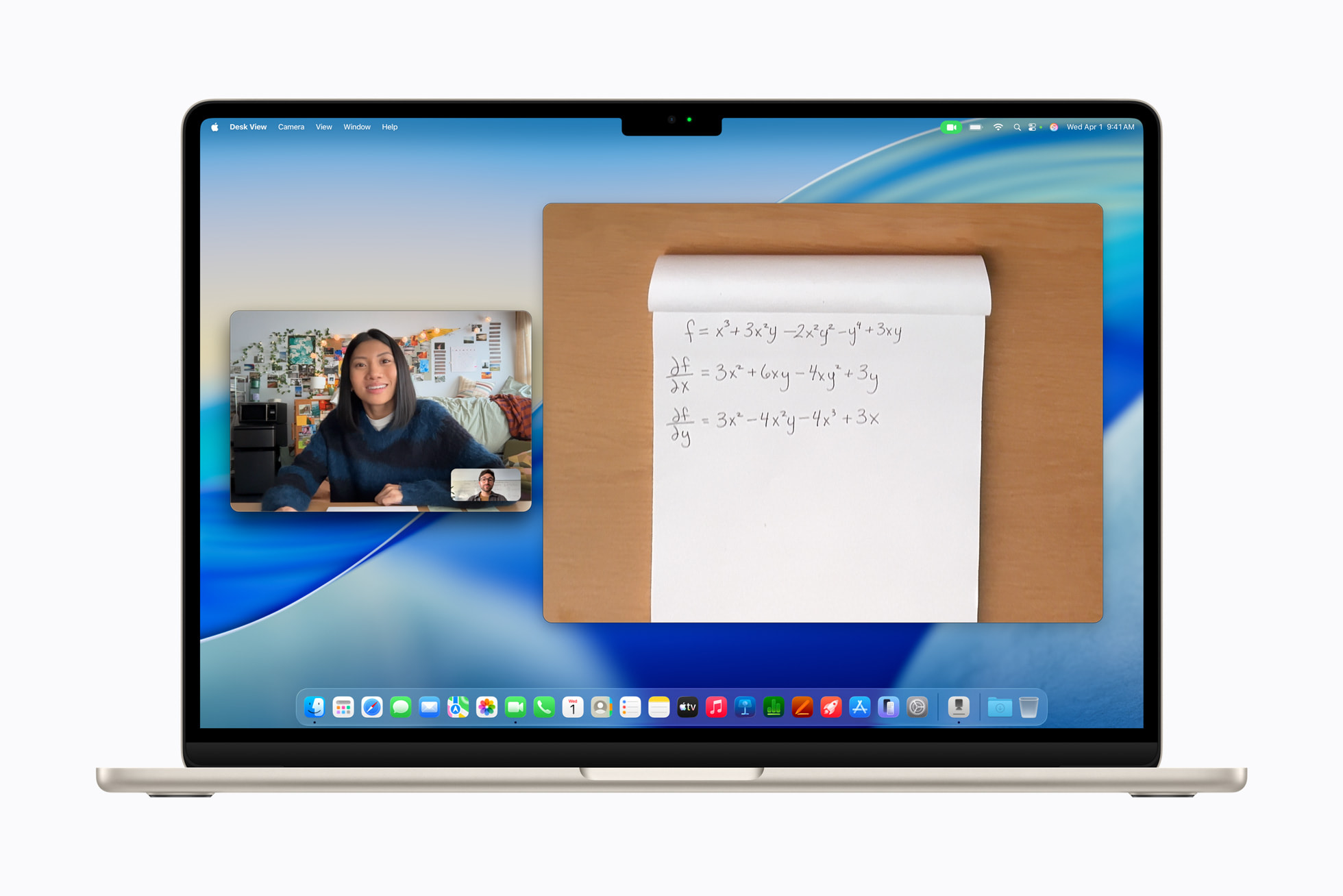 MacBook Air M5 open on a desk in a creative workspace