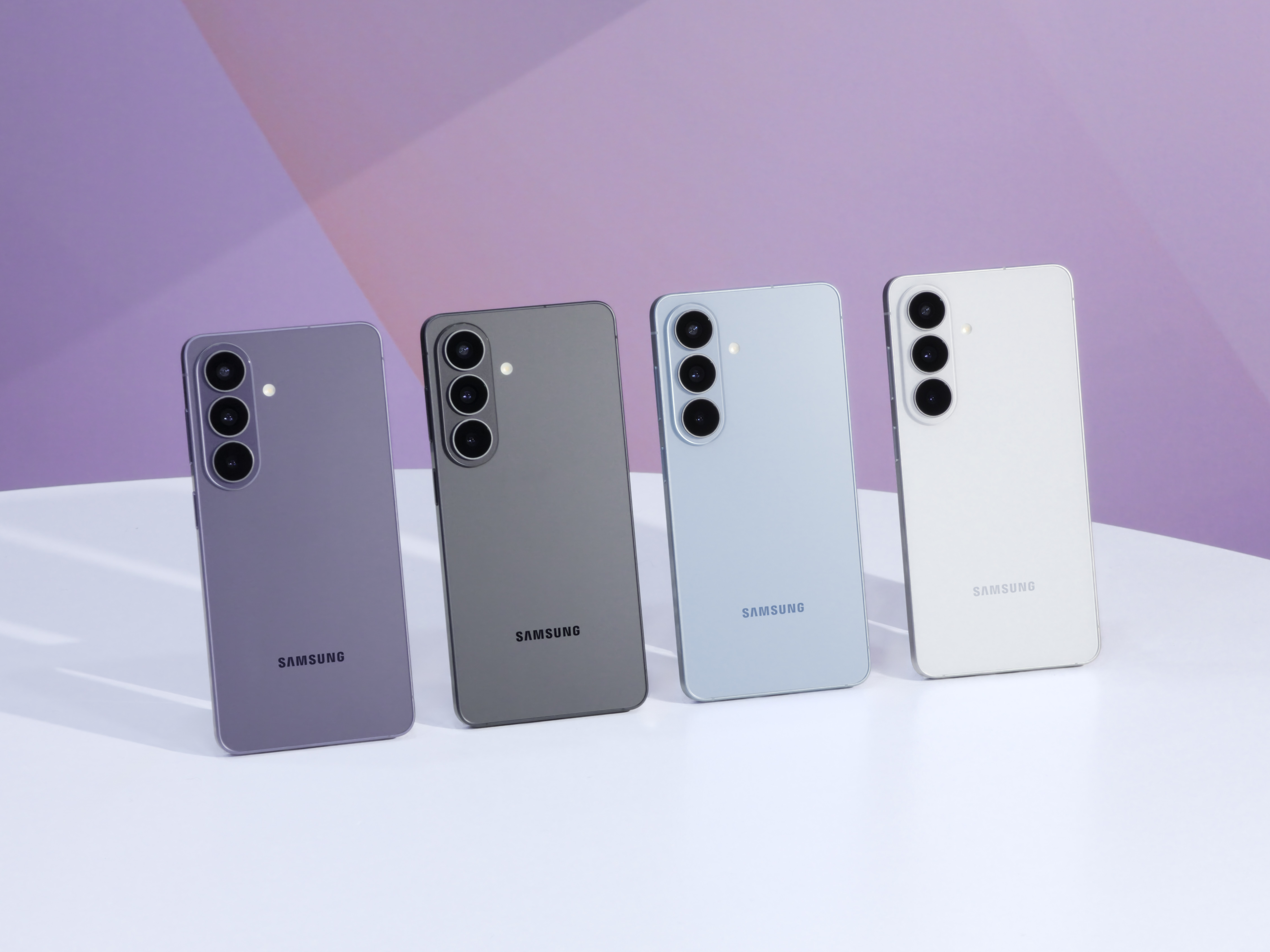 Four Samsung Galaxy S26 phones standing in lilac, graphite, light blue and white
