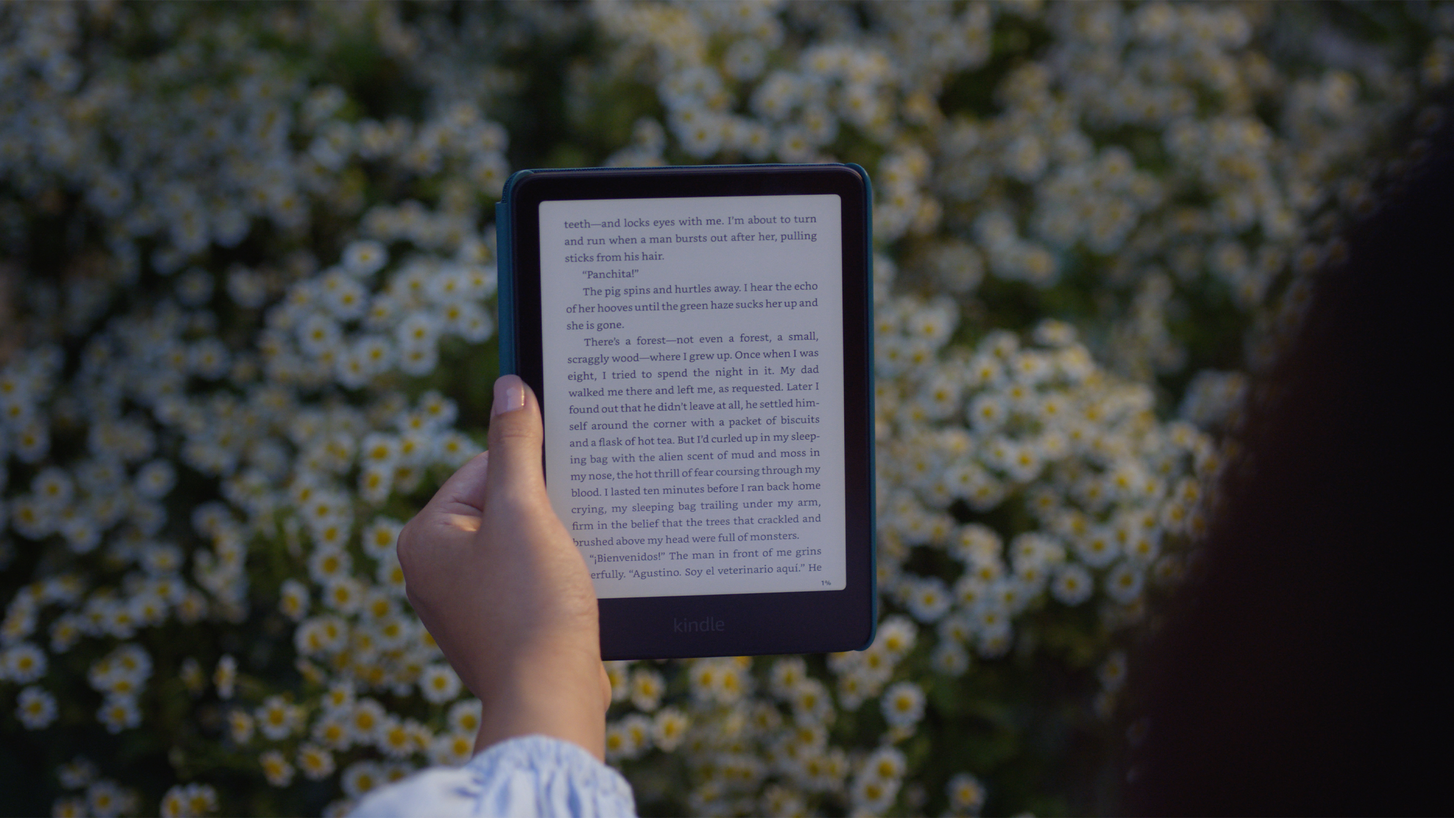 Amazon Kindle Paperwhite 2024 in raspberry, jade and black, front view on a pale surface