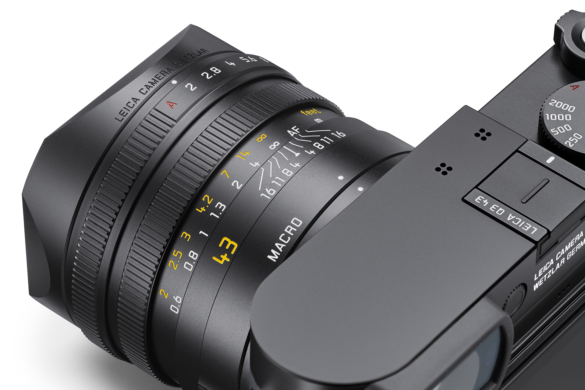 Close-up of the Leica Q3 43 fixed 43mm f/2 APO-Summicron lens showing aperture and focus markings