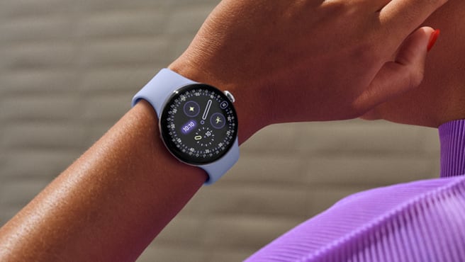 Pixel Watch 4 worn on a wrist showing a watch face