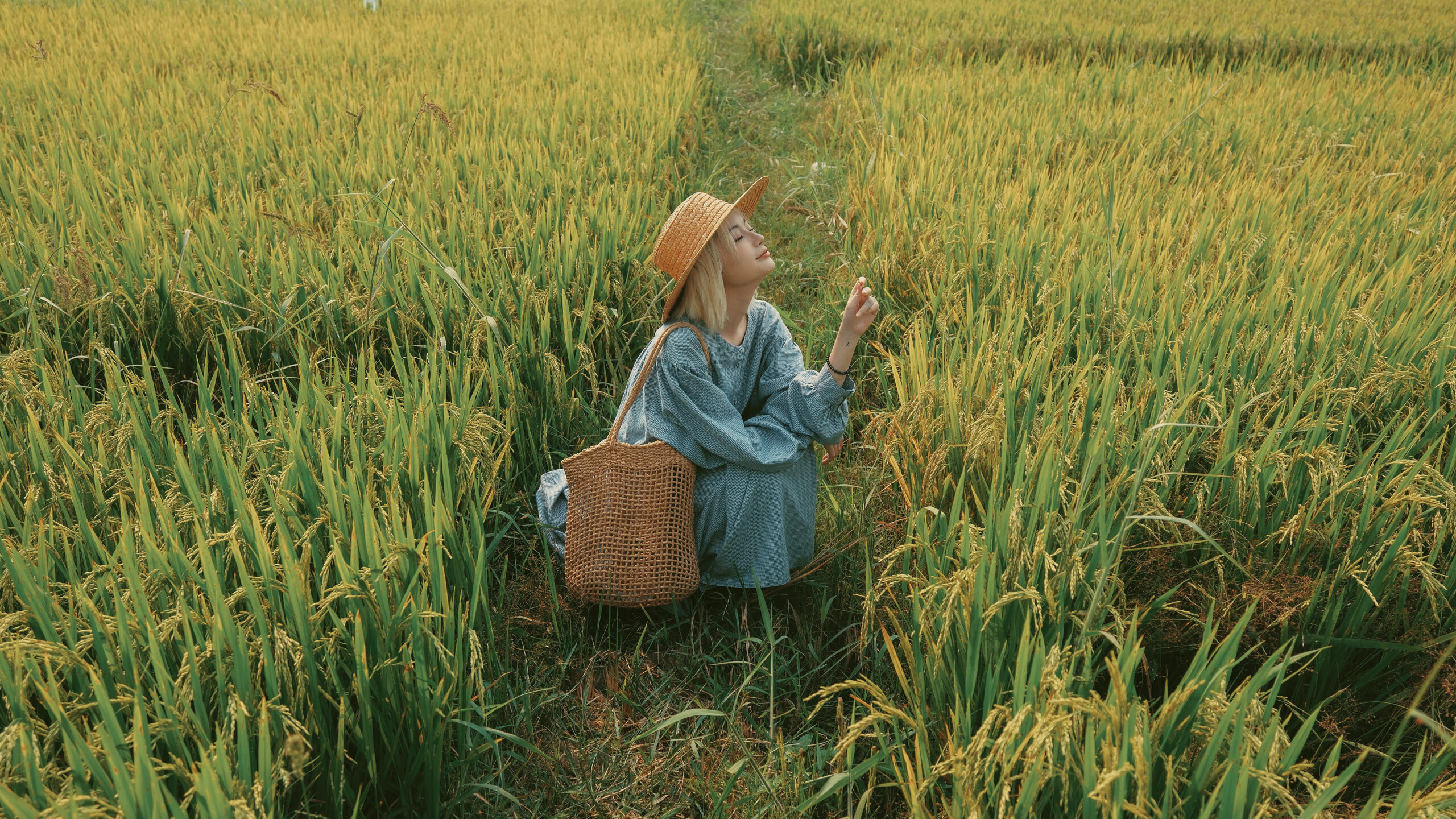 Environmental portrait of a person in a field shot on the Fujifilm X-T50