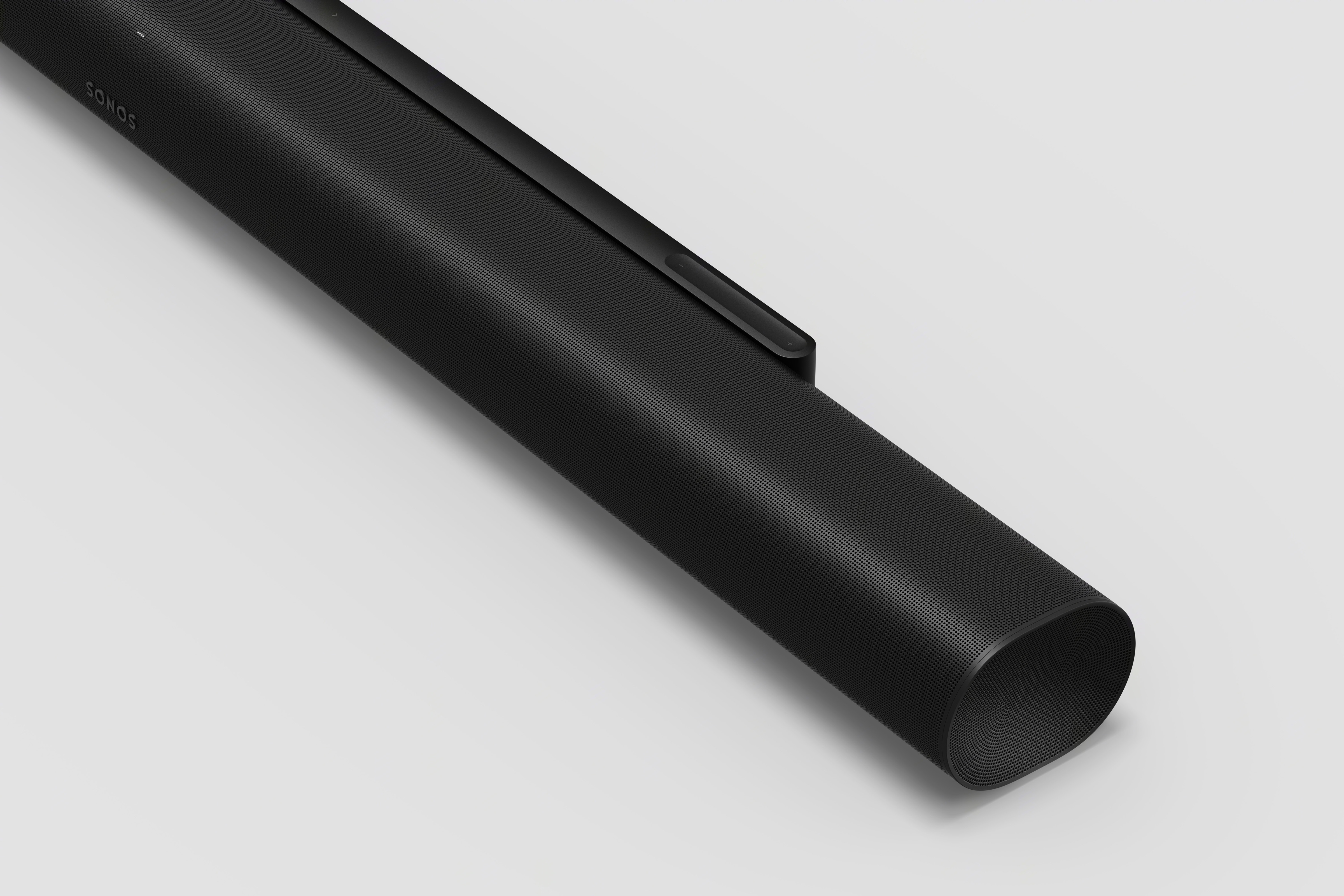 Close-up of the Sonos Arc Ultra in black showing the capacitive volume slider and touch ledge