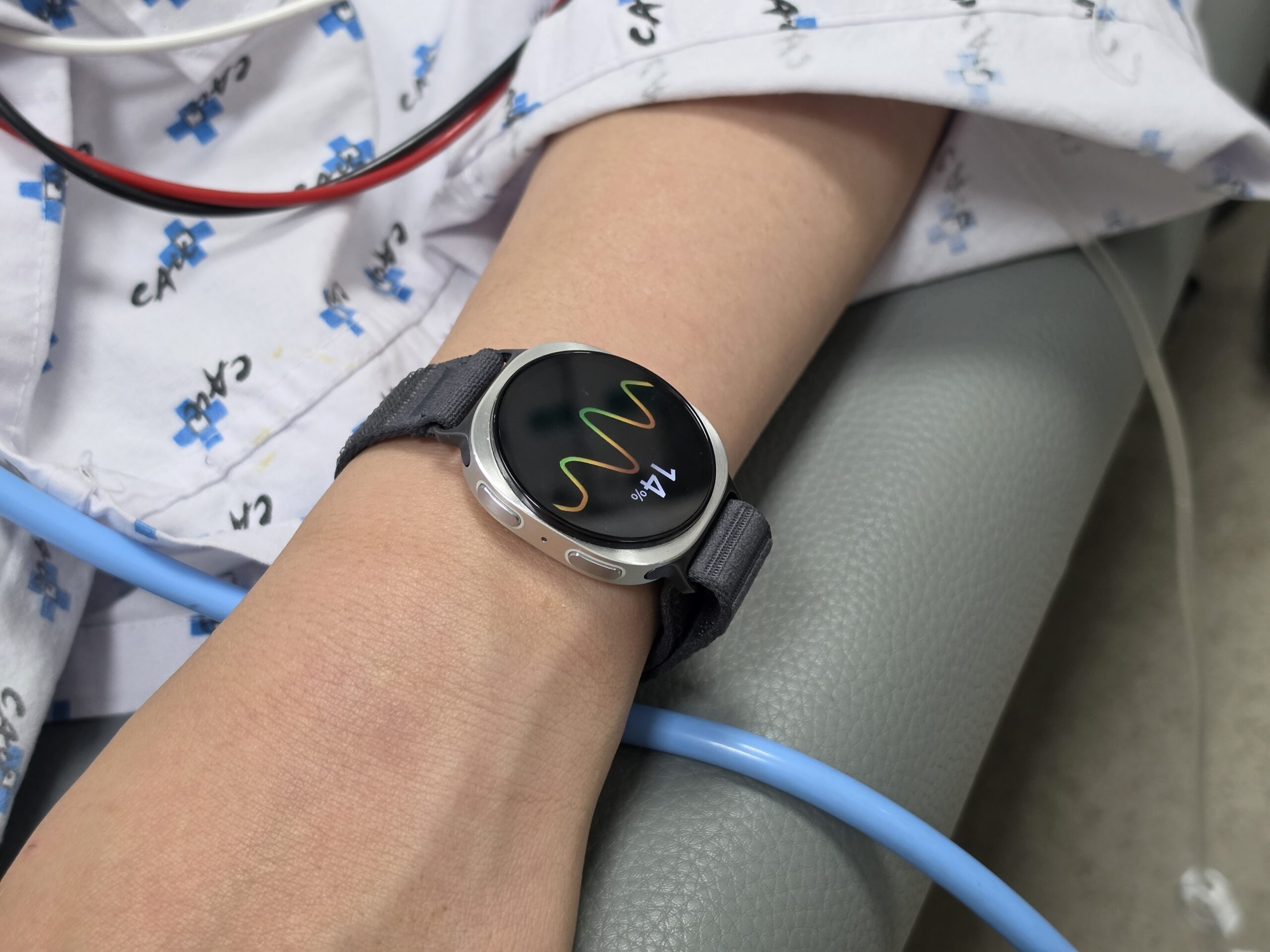 Samsung Galaxy Watch displaying a heart-rate health screen on the wrist