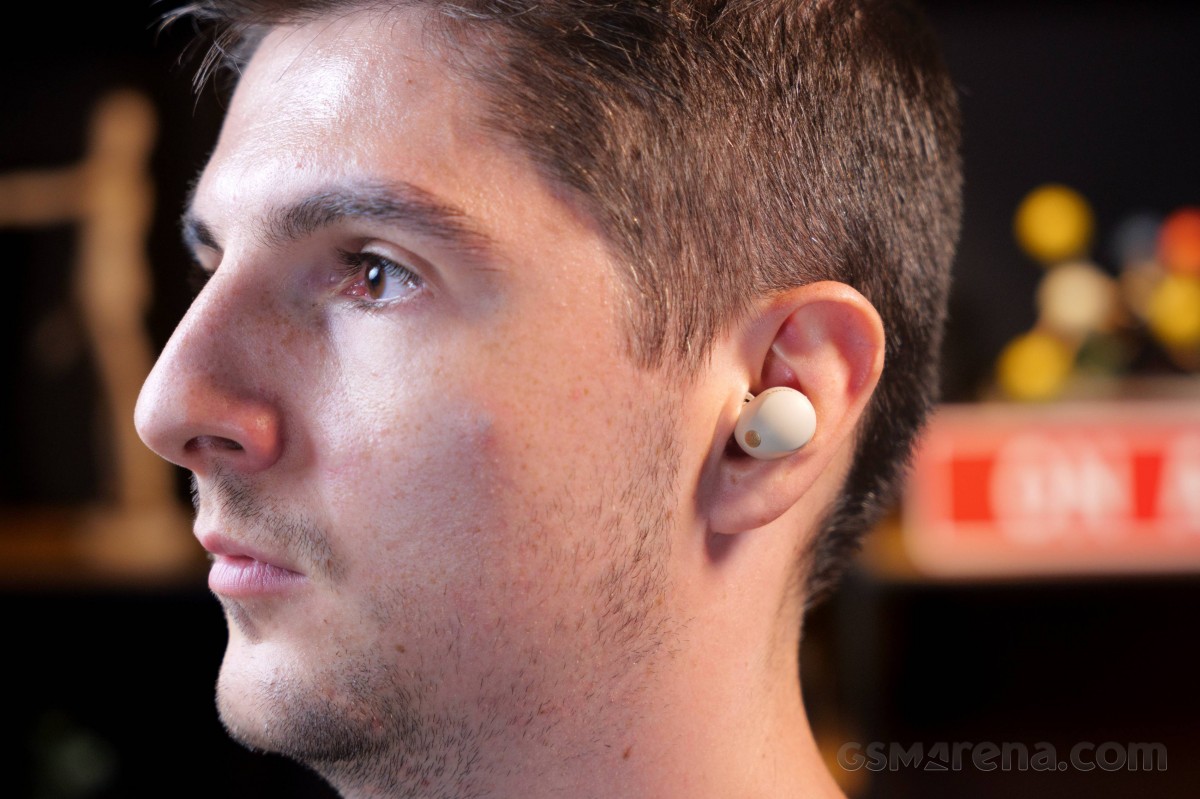 Man wearing a Sony WF-1000XM5 earbud, showing the in-ear fit