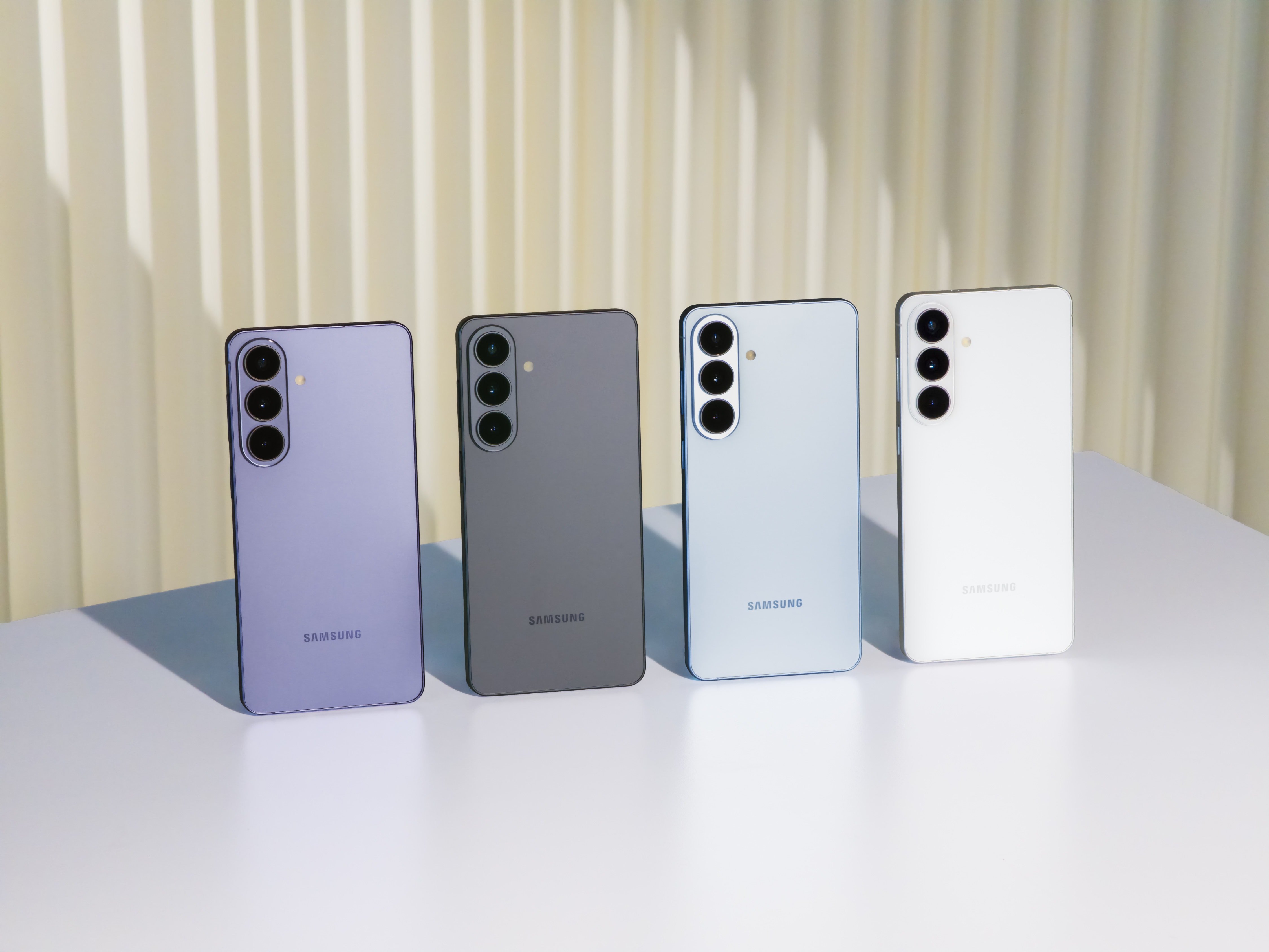 Samsung Galaxy S26 phones in four colours showing the rear camera layout