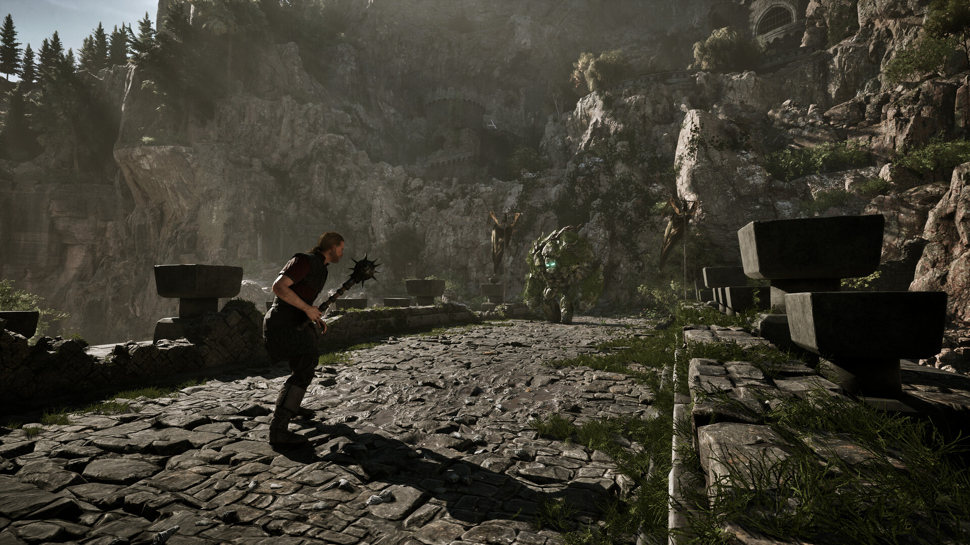 Gothic 1 Remake player wielding a mace facing a creature on a rocky stone path
