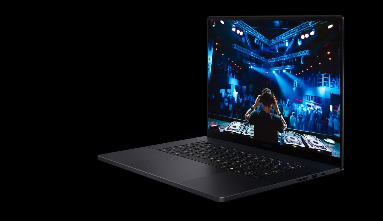 Asus ProArt P16 2026 open at an angle with a vivid concert scene on the OLED panel
