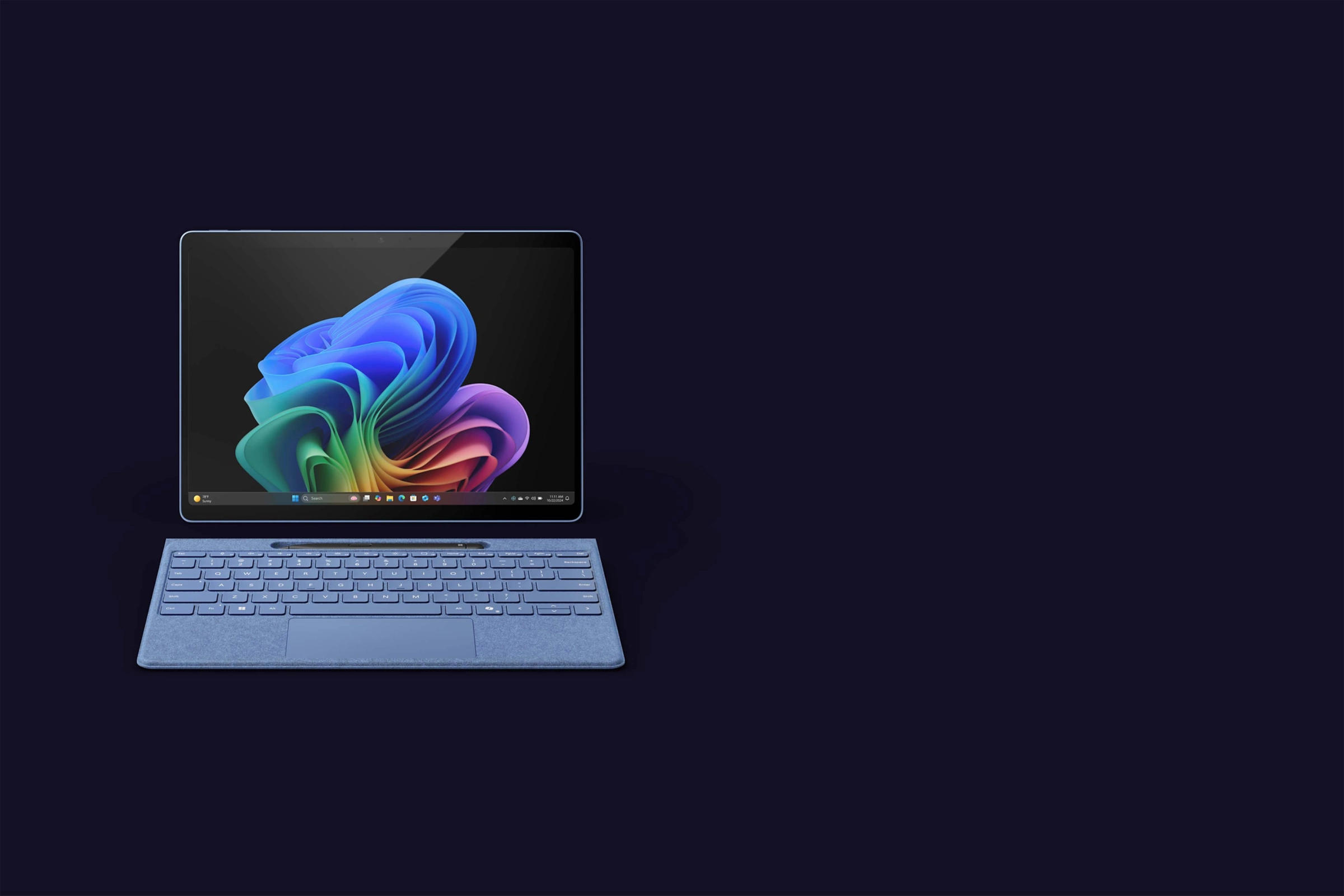 Microsoft Surface Pro 13-inch in sapphire shown front-on with detached keyboard on dark background