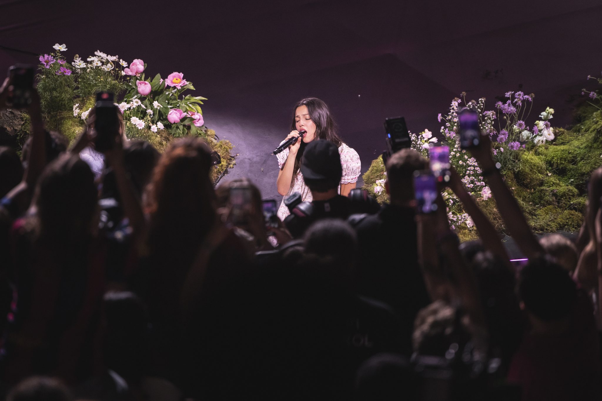 Olivia Rodrigo singing to the crowd during the Spotify Billions Club Live concert film