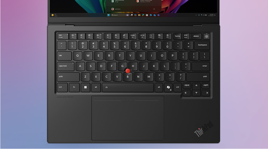 Overhead view of the full-sized keyboard, red TrackPoint and haptic touchpad on the Lenovo ThinkPad X1 Carbon Gen 14