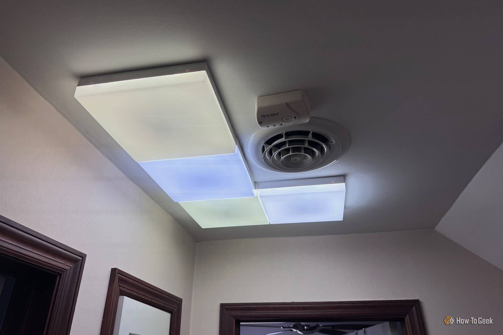 Nanoleaf Skylight casting coloured light across a room ceiling