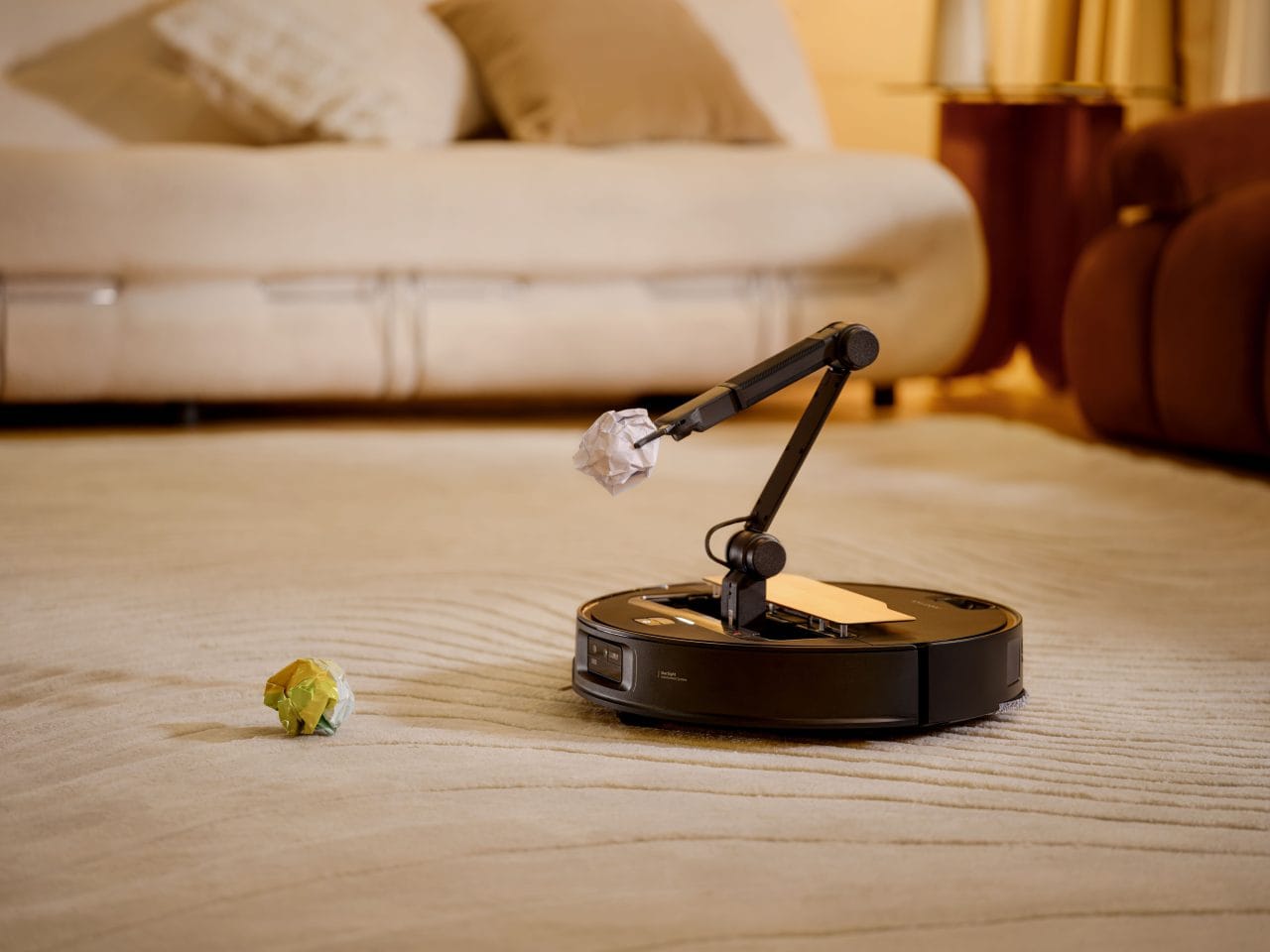 Roborock Saros Z70 robot vacuum with its folding OmniGrip mechanical arm