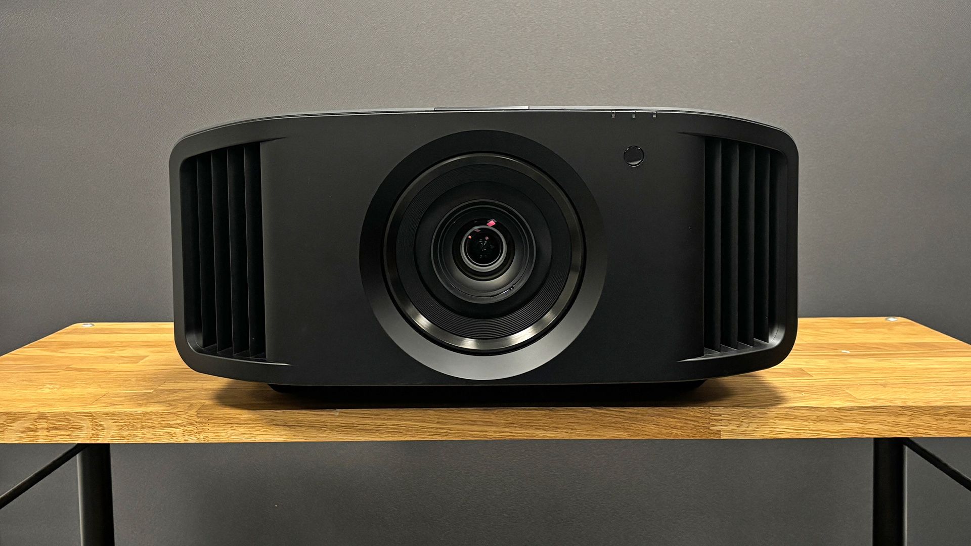 Epson 3LCD lamp projector producing a large cinematic image in a dimmed lounge