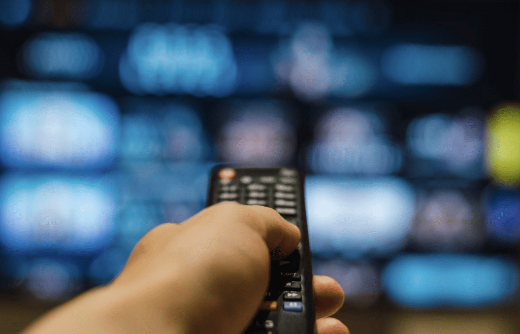 Virgin TV streaming line-up shown on a large screen in a retail setting