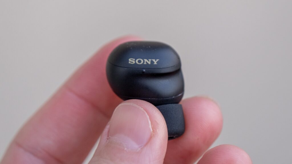 Sony WF-1000XM6 earbud held in hand showing the Sony logo